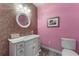 Charming bathroom featuring a round mirror, mosaic tile wall, and white vanity at 337 S Plant Ave, Tampa, FL 33606