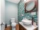 Stylish bathroom features a vessel sink, modern faucet, decorative tile wall, and updated fixtures at 337 S Plant Ave, Tampa, FL 33606