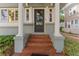 Elegant front entrance features classic columns and brick steps for a welcoming approach at 337 S Plant Ave, Tampa, FL 33606