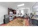 Office featuring a large rug, wooden book shelf, and plenty of desk space for storage and organization at 337 S Plant Ave, Tampa, FL 33606