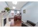 Bright office space features hardwood floors, a cozy chair, and a fireplace feature at 337 S Plant Ave, Tampa, FL 33606
