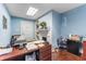 Office space with a decorative fireplace, dark wood floors, and a desk with organization at 337 S Plant Ave, Tampa, FL 33606