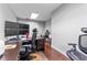 Bright office with wood floors featuring multiple monitors, ergonomic chairs and minimalist design at 337 S Plant Ave, Tampa, FL 33606