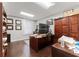 Professional office space featuring wood floors, bright lighting, and a large wooden desk at 337 S Plant Ave, Tampa, FL 33606