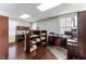 Spacious office area with dark wood floors, bright windows, multiple workspaces, and built-in shelving at 337 S Plant Ave, Tampa, FL 33606