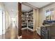 Office space with shelves filled with books and documents, wood floors, and a copy machine at 337 S Plant Ave, Tampa, FL 33606
