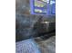 Sleek bathroom featuring a modern vanity with black textured sink and blue tile accents at 3911 6Th W Ave, Palmetto, FL 34221
