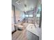 Modern bathroom featuring sleek gray tiling, floating toilet, and contemporary vanity and lighting at 3911 6Th W Ave, Palmetto, FL 34221
