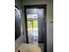 Bathroom entrance featuring tiled floor and view to exterior through sliding glass doors at 3911 6Th W Ave, Palmetto, FL 34221
