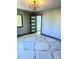 Modern bedroom with geometric tile flooring and black-framed doorway at 3911 6Th W Ave, Palmetto, FL 34221
