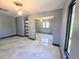 Stylish bedroom featuring tile flooring, mirrored closet doors, and modern light fixture at 3911 6Th W Ave, Palmetto, FL 34221