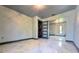 Bedroom showcasing tile flooring, closet and laundry area for added convenience at 3911 6Th W Ave, Palmetto, FL 34221