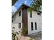 Modern two story home showcasing mixed siding, clean lines, and dark framed windows at 3911 6Th W Ave, Palmetto, FL 34221