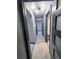 Hallway with modern lighting and doors that enhance the architectural appeal of this stylish home at 3911 6Th W Ave, Palmetto, FL 34221