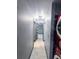 Hallway view showcasing updated flooring and lighting fixtures, plus a laundry area at 3911 6Th W Ave, Palmetto, FL 34221