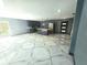 Open kitchen and living room featuring modern finishes and geometric tiling at 3911 6Th W Ave, Palmetto, FL 34221