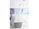 Kitchen island featuring marble countertop, pendant lights, and stainless steel refrigerator at 3911 6Th W Ave, Palmetto, FL 34221