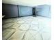 Expansive living room with spiral staircase and geometric tile flooring at 3911 6Th W Ave, Palmetto, FL 34221