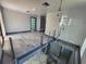 Upper-level view of open living room featuring a spiral staircase at 3911 6Th W Ave, Palmetto, FL 34221