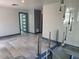 Upper-level view of open living room featuring modern lighting and spiral staircase at 3911 6Th W Ave, Palmetto, FL 34221