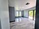 A naturally lit living room features sliding glass doors, recessed lights and access to the deck at 3911 6Th W Ave, Palmetto, FL 34221