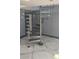 Modern spiral staircase with a metal frame and wood steps adjacent to a unique interior door at 3911 6Th W Ave, Palmetto, FL 34221