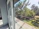 Exterior wooden deck with great views of lush trees at 3911 6Th W Ave, Palmetto, FL 34221