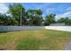 Huge, grassy backyard surrounded by a tall privacy fence, providing a secure and expansive outdoor space at 4014 W Swann Ave, Tampa, FL 33609