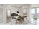 Stylish kitchen featuring stainless steel appliances, island with seating, and modern cabinetry at 411 E Shore Drive # 212, Clearwater Beach, FL 33767