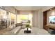 Inviting living room with ocean views, comfortable seating, and contemporary design at 411 E Shore Drive # 212, Clearwater Beach, FL 33767