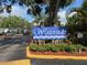 Waterside community sign with lush landscaping and a view of the neighborhood at 4127 Dolphin Dr # 4127, Tampa, FL 33617