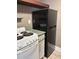 Kitchen featuring clean white appliances with modern countertops, and modern vinyl flooring at 4127 Dolphin Dr # 4127, Tampa, FL 33617