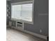 Bright living room with a large window and gray walls, and sleek modern vinyl flooring at 4127 Dolphin Dr # 4127, Tampa, FL 33617