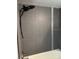 Contemporary shower with sleek gray tiles, modern showerhead, and a bathtub at 4127 Dolphin Dr # 4127, Tampa, FL 33617