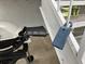 Close up of the supra lockbox attached to a staircase near the grill at 4127 Dolphin Dr # 4127, Tampa, FL 33617