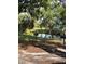 Water view with two barbeque grills and lush landscaping at 4127 Dolphin Dr # 4127, Tampa, FL 33617