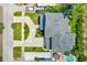 Beautiful home with a circular driveway, lush landscaping, and a backyard pool, offering a serene outdoor retreat at 4710 W El Prado Blvd, Tampa, FL 33629