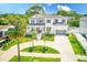 Beautiful two-story home boasts a charming front porch, manicured lawn, and a welcoming curb appeal at 4710 W El Prado Blvd, Tampa, FL 33629