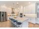 Modern kitchen featuring stainless steel appliances, a large island, and ample cabinet space at 4710 W El Prado Blvd, Tampa, FL 33629