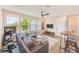 Bright living room with a sectional sofa, natural light, and modern design at 4710 W El Prado Blvd, Tampa, FL 33629