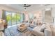 Spacious living room with a view of kitchen and backyard at 4710 W El Prado Blvd, Tampa, FL 33629