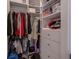 Organized walk-in closet featuring rods and shelves for efficient storage of clothes, shoes, and accessories at 4710 W El Prado Blvd, Tampa, FL 33629