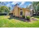 Expansive backyard featuring a well-maintained lawn and manicured landscaping, creating a private outdoor oasis at 495 Palmdale Dr, Oldsmar, FL 34677