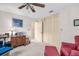 Bedroom featuring ample closet space and a ceiling fan for added comfort at 495 Palmdale Dr, Oldsmar, FL 34677