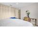Bright bedroom features a neutral palette, ceiling fan, and closet with louvered doors at 495 Palmdale Dr, Oldsmar, FL 34677