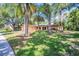Serene single-story home with mature trees providing ample shade to the sprawling front yard at 495 Palmdale Dr, Oldsmar, FL 34677