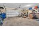 Spacious garage with ample storage and a roll-up door, ideal for organization and accessibility at 495 Palmdale Dr, Oldsmar, FL 34677