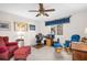 Comfortable office space featuring a ceiling fan, large window, and a relaxed sitting area at 495 Palmdale Dr, Oldsmar, FL 34677
