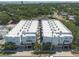 High angle aerial view of modern buildings with water and trees in the distance at 5008 S Macdill Ave # 10, Tampa, FL 33611