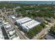 An aerial view of a white three-story apartment complex near the waterfront of St. Petersburg, Florida at 5008 S Macdill Ave # 10, Tampa, FL 33611